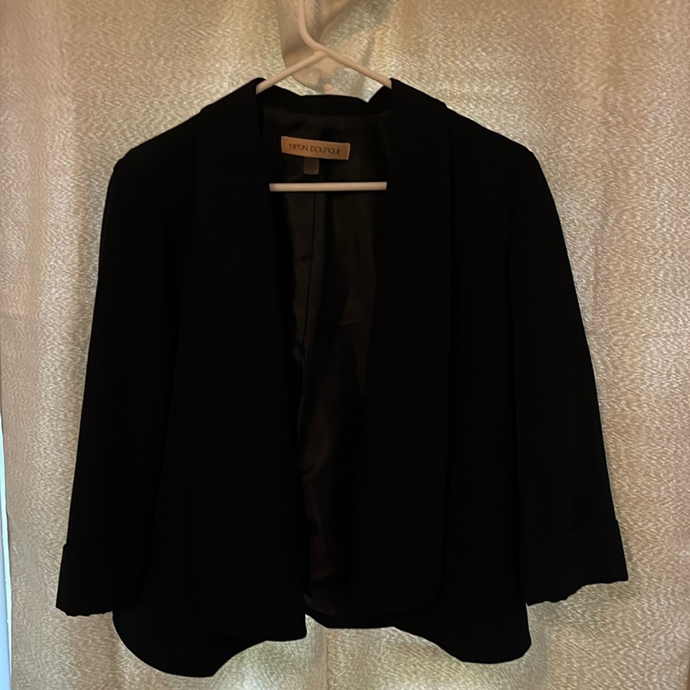 Nipon Boutique Blazer crop at waist with sleeves above wrist.